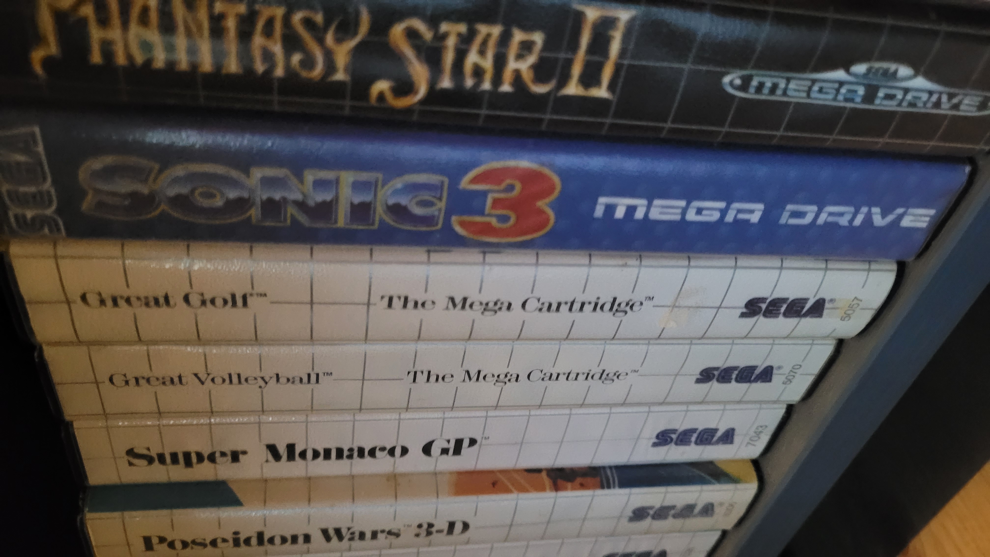 Stack of Sega game boxes